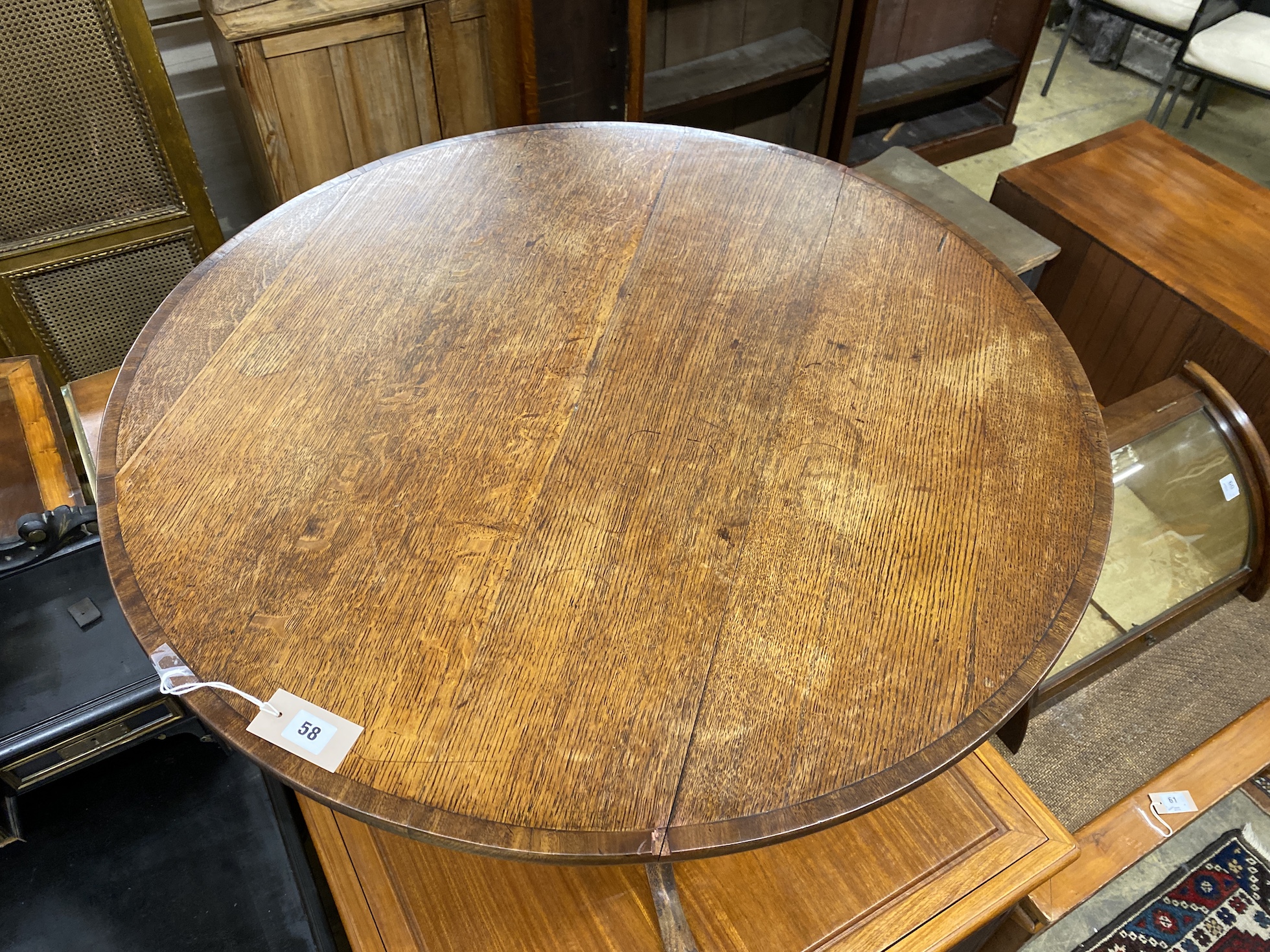 A George III mahogany banded circular oak tilt top tea table, diameter 89cm, height 71cm